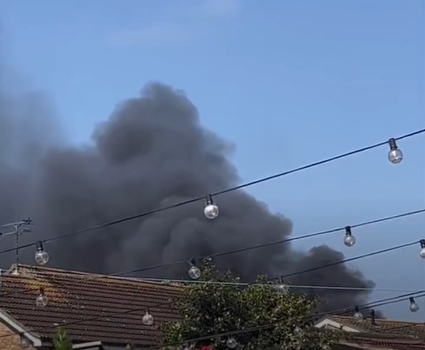 Rainham industrial yard fire produces thick clouds of smoke