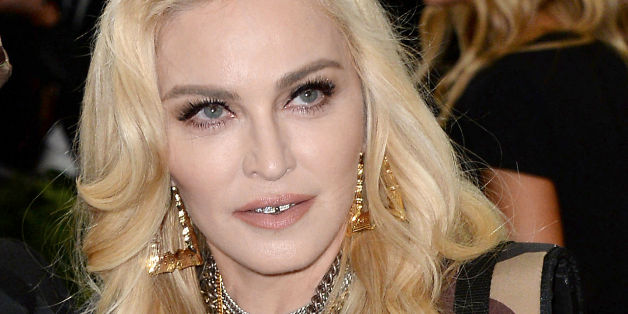 Madonna postpones world tour after intensive care stay