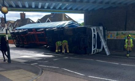 Lorry overturns after bridge crash near Fairlop Tube station