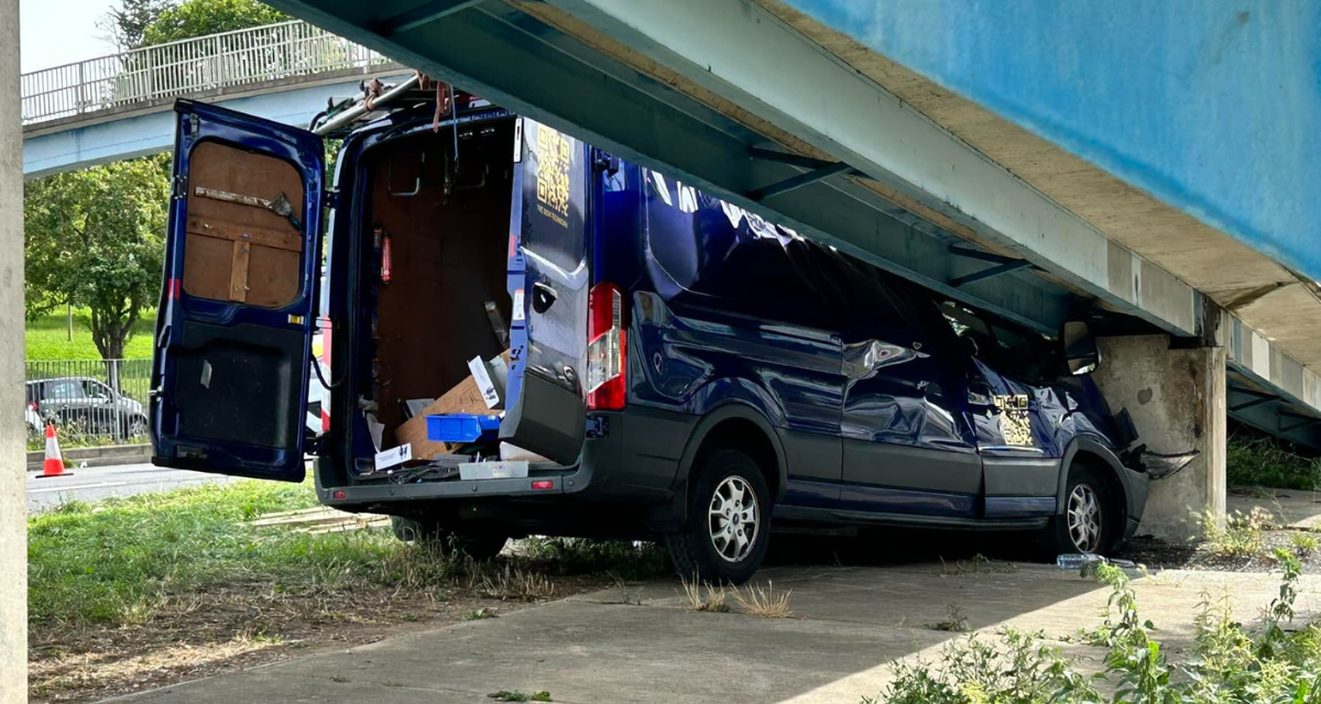 Van damaged after crash into a Romford pedestrian overpass